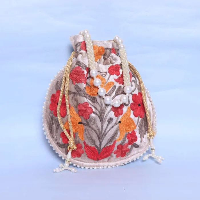 Stylish Cream Velvet Potli Bag with Detailed Aari Work