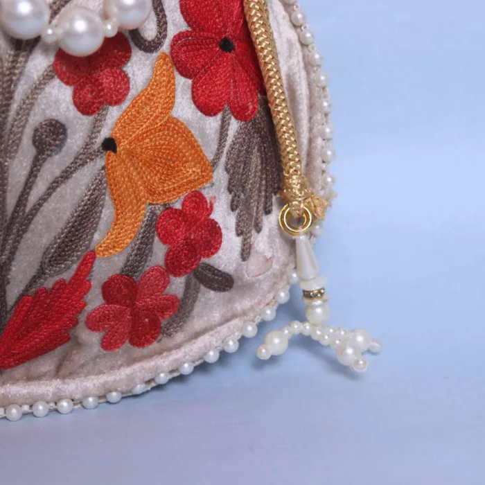 Stylish Cream Velvet Potli Bag with Detailed Aari Work - Image 3